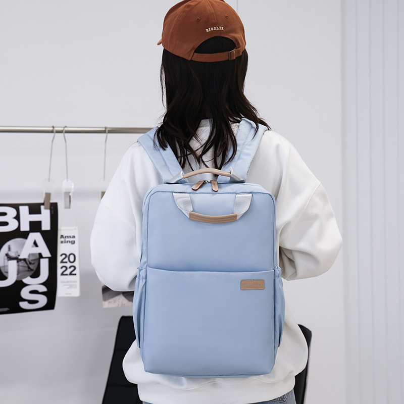 Unisex gradski ruksak, prozračni visokohustotni poliester, kapacitet 20–35L, zakrivljeni ramenski pojas