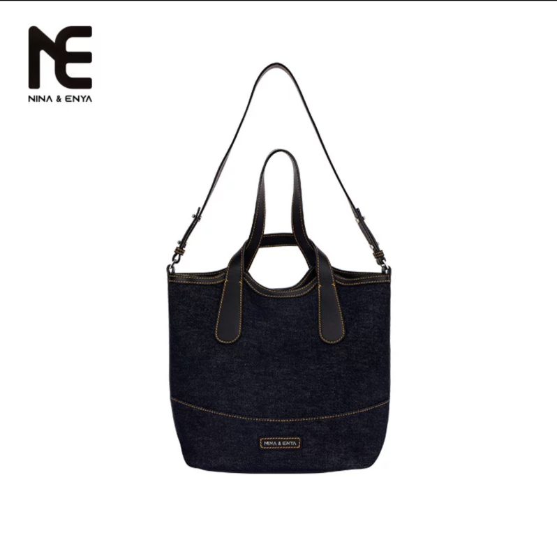 Bucket torba - urban stil jednostavnosti; Materijal: Oxford tkanina; Oblik: bucket tip; Otvaranje: magnetska kopča; Podstava: platno