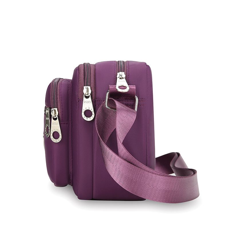 Ženska crossbody torba od Oxford platna, vodoravnog kvadratnog oblika, zatvaranje zipom, unutarnja džep na zip