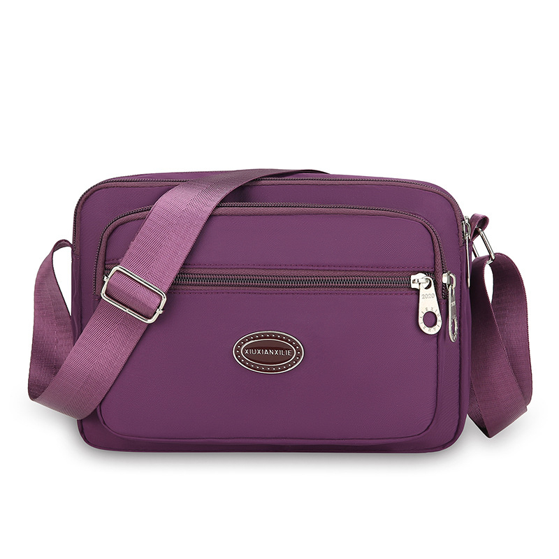 Ženska crossbody torba od Oxford platna, vodoravnog kvadratnog oblika, zatvaranje zipom, unutarnja džep na zip