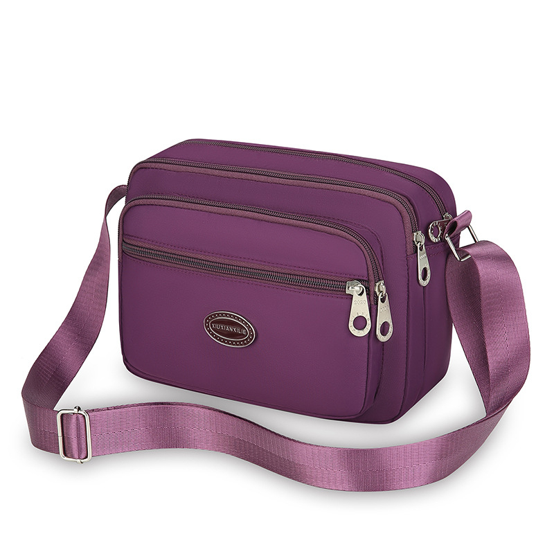 Ženska crossbody torba od Oxford platna, vodoravnog kvadratnog oblika, zatvaranje zipom, unutarnja džep na zip