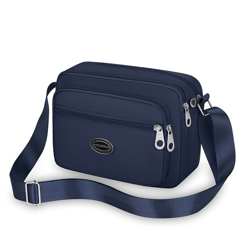 Ženska crossbody torba od Oxford platna, vodoravnog kvadratnog oblika, zatvaranje zipom, unutarnja džep na zip