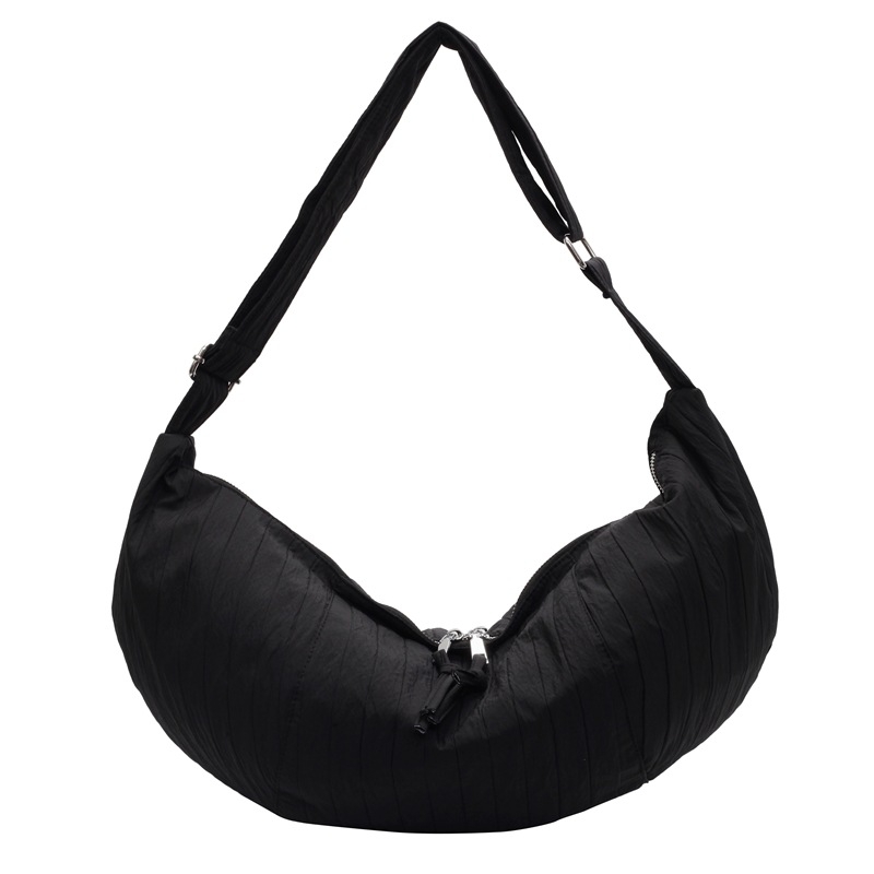 Naju crossbody torbica, najlonski materijal, vodoravni kvadratni oblik, zatvaranje na zip, velika kapaciteta