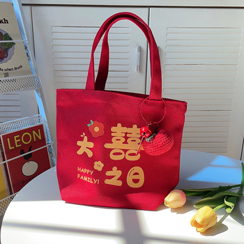 Ženska torbica — vertikalni kvadratni oblik, platnen materijal, književni nacionalni stil, otvoren vrh, mekana konstrukcija, svakodnevna uporaba