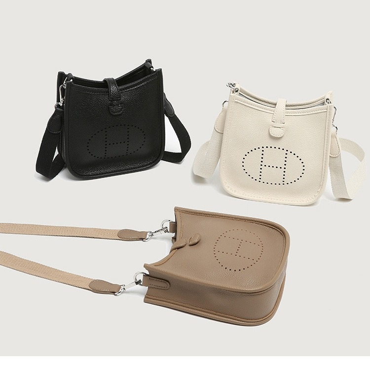 Geantă Evelyn pentru femei: din piele naturală pentru telefon mobil, formă găleată, închidere magnetică, căptușeală din piele de bovine (Material: Piele naturală; Stil: Geantă pentru telefon; Formă: Găleată; Închidere: Magnetic)