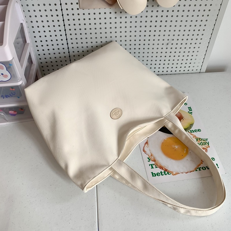 Oxford szövetből készült tote táska városi egyszerű stílusban, cipzáras nyitás, poliészter bélés, belső telefonzseb