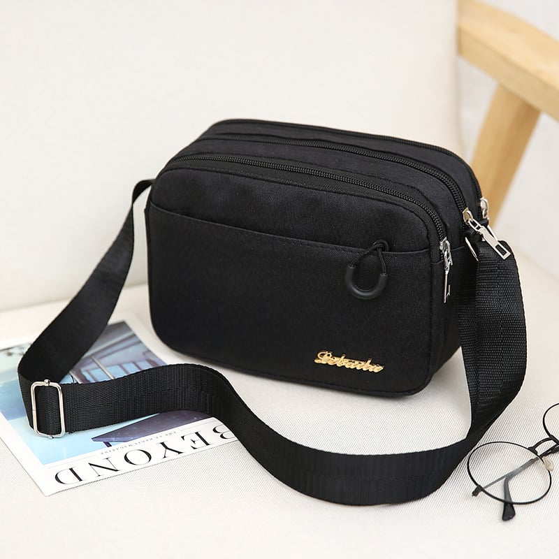 Ženska crossbody torba, kvadratnog oblika, Oxford plat, zatvarač, poliester podstava, jedna naramenica, urbani minimalistički stil