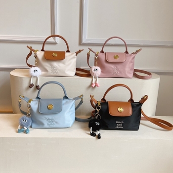 Ženska mini dumpling torbica, crossbody i ručno nošenje, lagana i kompaktna