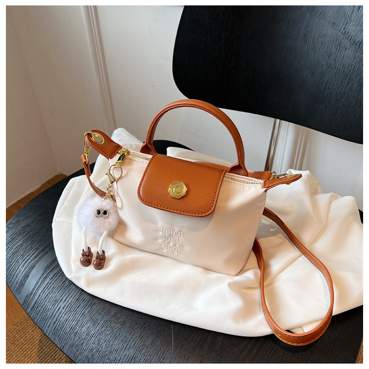 Ženska mini dumpling torbica, crossbody i ručno nošenje, lagana i kompaktna