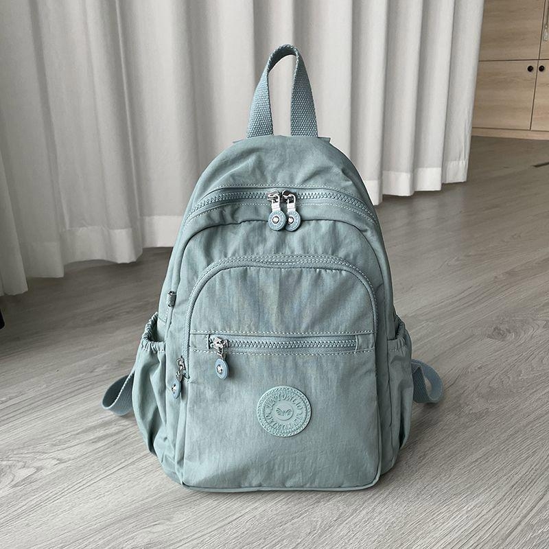 Ženski ruksak od Oxford platna, vodootporan, trodimenzionalni vanjski dizajn, unutarnja laminirana džep s zatvaračem i međuspremnik, zimska 2024 kolekcija