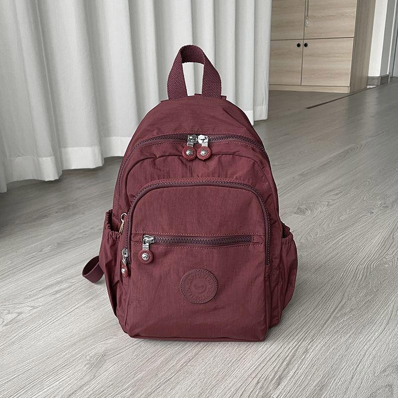 Ženski ruksak od Oxford platna, vodootporan, trodimenzionalni vanjski dizajn, unutarnja laminirana džep s zatvaračem i međuspremnik, zimska 2024 kolekcija