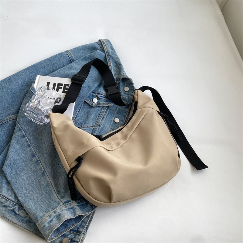 Crossbody Dumpling torba — Oxford platno, najlonska podstava, zatvaranje zatvaračem, unutarnja pretinica za telefon