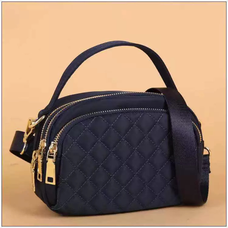 Ženska crossbody torba s prošivenim nitima, gradski minimalistički stil, mala kvadratna torba, Oxford materijal, zatvarač, unutarnji džepovi za telefon i dokumente