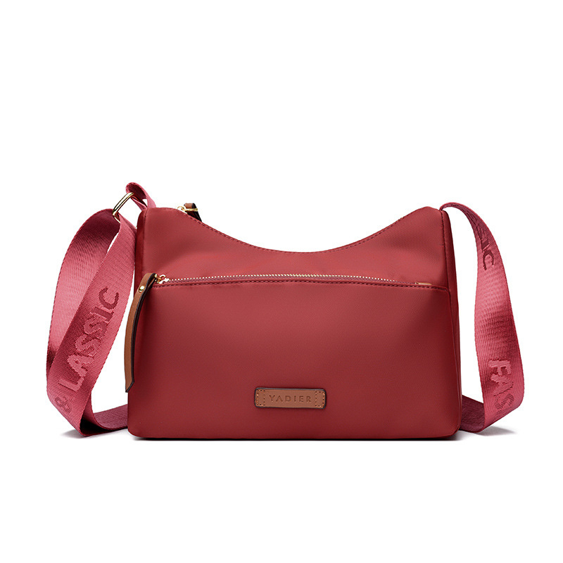 Ženska crossbody torbica u gradskom stilu od Oxford platna, vodoravno kvadratnog oblika, s džepom na zip