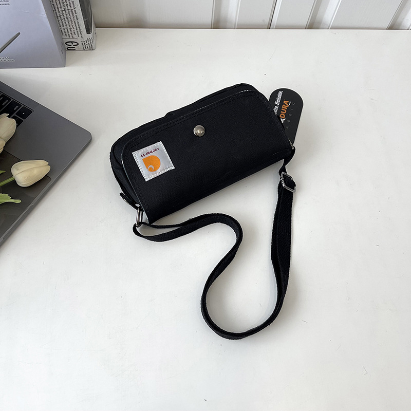 Crossbody torba — Oxford materijal, horizontalni kvadratni dizajn, zatvaranje s poklopcem, unutarnji džepovi za telefon i osobnu iskaznicu