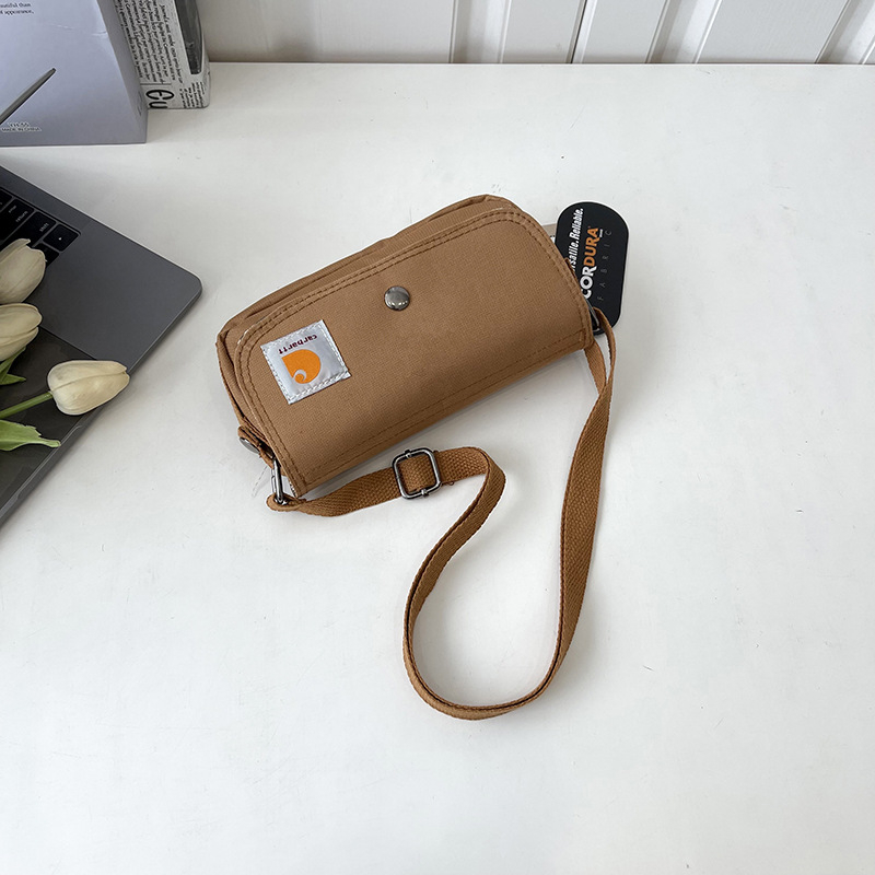 Crossbody torba — Oxford materijal, horizontalni kvadratni dizajn, zatvaranje s poklopcem, unutarnji džepovi za telefon i osobnu iskaznicu