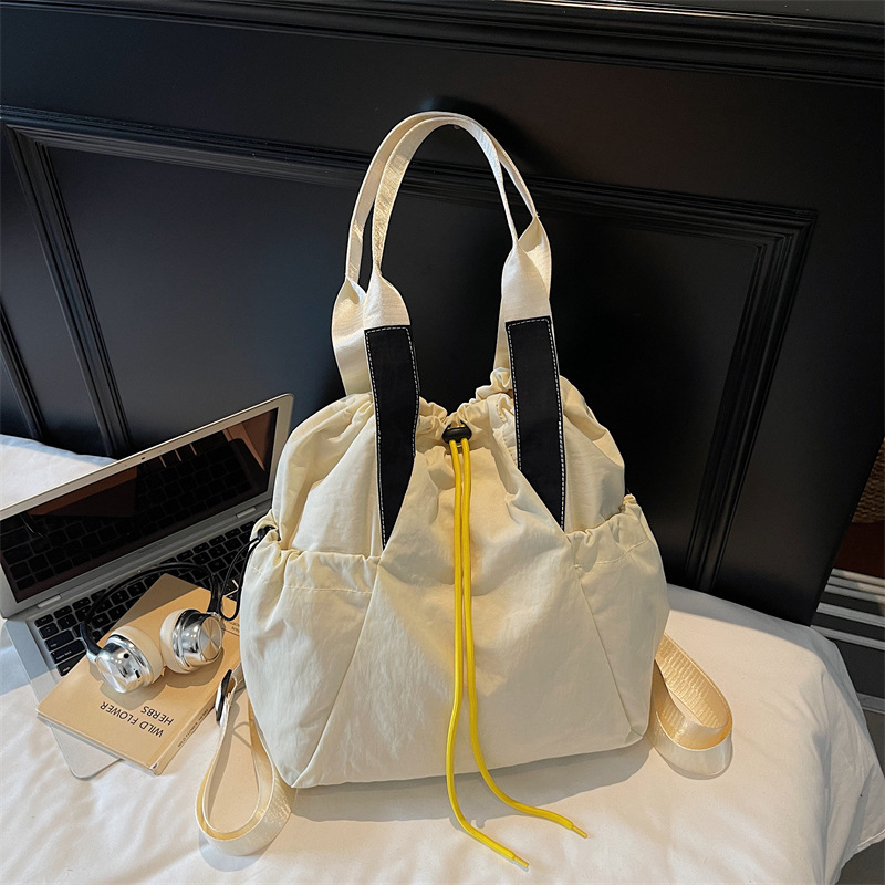 Ženska crossbody bucket torba — uličnog stila, Oxford materijal, otvaranje šnuralom, unutarnji džep na zip i džep za dokumente, dvostruki remeni, pogodna za svakodnevnu upotrebu