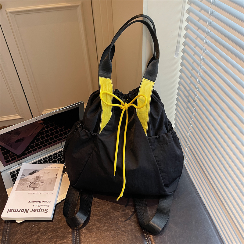 Ženska crossbody bucket torba — uličnog stila, Oxford materijal, otvaranje šnuralom, unutarnji džep na zip i džep za dokumente, dvostruki remeni, pogodna za svakodnevnu upotrebu