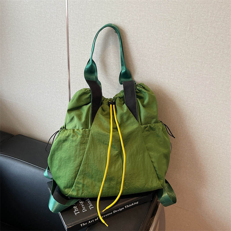 Ženska crossbody bucket torba — uličnog stila, Oxford materijal, otvaranje šnuralom, unutarnji džep na zip i džep za dokumente, dvostruki remeni, pogodna za svakodnevnu upotrebu