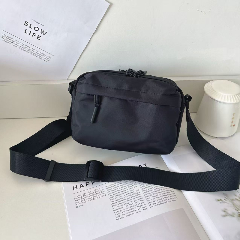 Unisex crossbody torba, vodootporna najlon konstrukcija, više džepova, zatvarač i džep za telefon