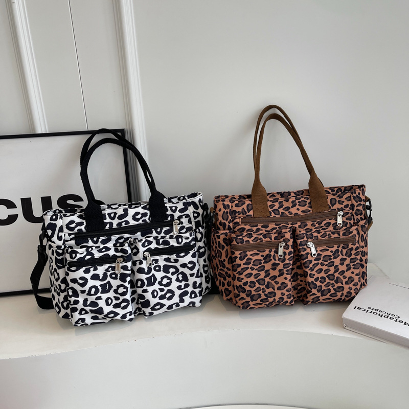Torba tote s leopard printom - Velika kapaciteta (Oxford tkanina, zatvarač, horizontalni kvadratni oblik, poliester podstava, unutarnji džepovi za telefon i karticu)