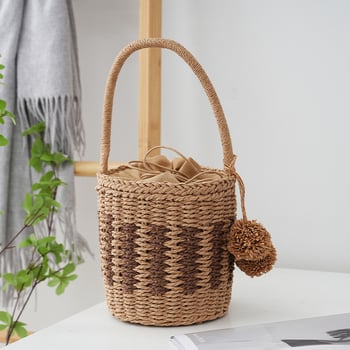 Ženska bucket bag od papirnatog užeta, podstava od platna, zatvaranje šnnom, vodoravni pravokutni oblik, unutarnji džep za dokumente
