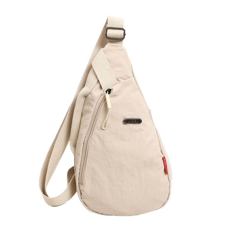Crossbody torba u urbanom minimalističkom stilu, Oxford tkanina, zatvarač, unutarnji džep sa zipom i džep za telefon, proljeće 2025