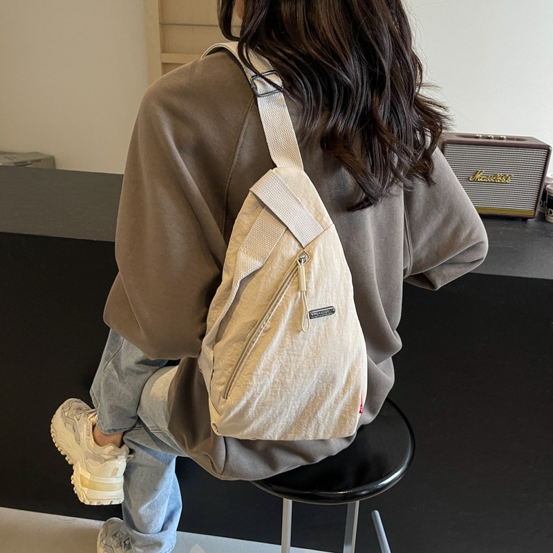 Unisex nylon crossbody torba, ovalnog oblika, zip zatvaranje, poliester podstava, laminirani džep