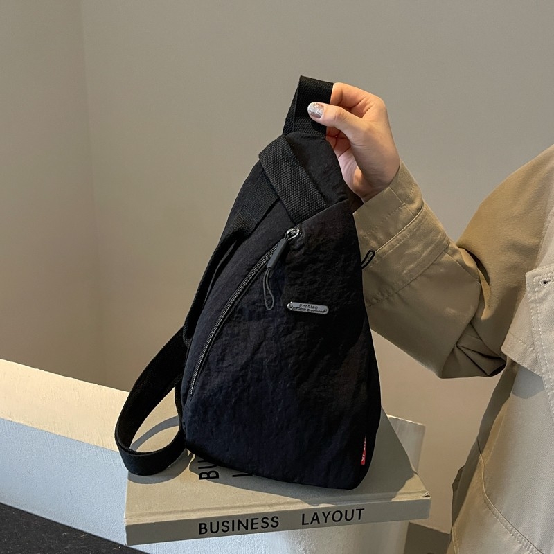 Unisex nylon crossbody torba, ovalnog oblika, zip zatvaranje, poliester podstava, laminirani džep
