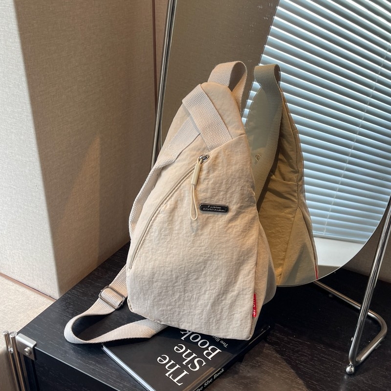 Unisex nylon crossbody torba, ovalnog oblika, zip zatvaranje, poliester podstava, laminirani džep