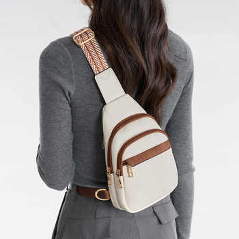 Crossbody torbica od PU materijala, ovalni oblik, zatvaranje na zip, unutarnja džep s džepom za ID - Charm Infinite