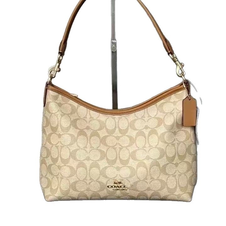 Koujia Laurel31 dumpling- oblikovana crossbody torba od PVC-a, gradski stil, s zatvaranjem na zip i unutarnjim džepom sa zipom