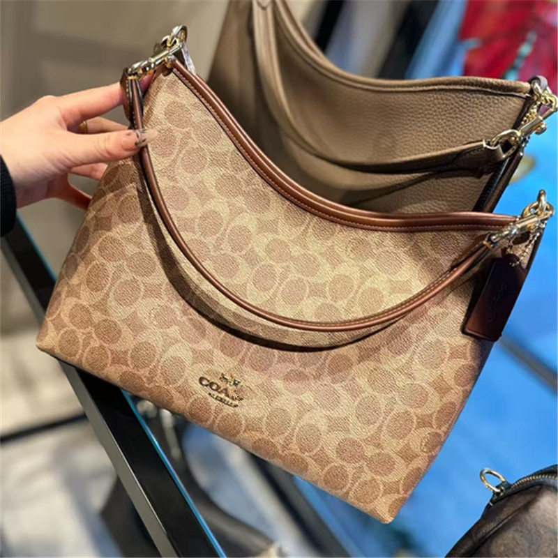 Koujia Laurel31 dumpling- oblikovana crossbody torba od PVC-a, gradski stil, s zatvaranjem na zip i unutarnjim džepom sa zipom