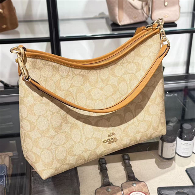 Koujia Laurel31 dumpling- oblikovana crossbody torba od PVC-a, gradski stil, s zatvaranjem na zip i unutarnjim džepom sa zipom