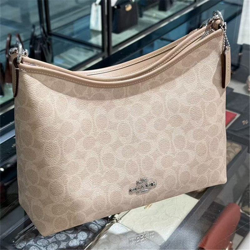 Koujia Laurel31 dumpling- oblikovana crossbody torba od PVC-a, gradski stil, s zatvaranjem na zip i unutarnjim džepom sa zipom