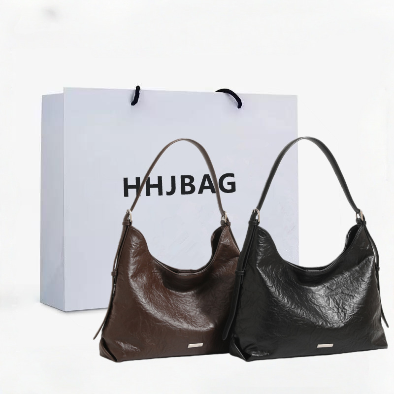 Htjbag od prave kože, hobó torba za putovanja, jesen 2025, zatvarač