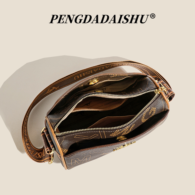 Ženska torbica za rame oblik jastučastog tipa, PU materijal, podstava od poliester, zatvaranje zatvaračem, unutarnja džep s zatvaračem