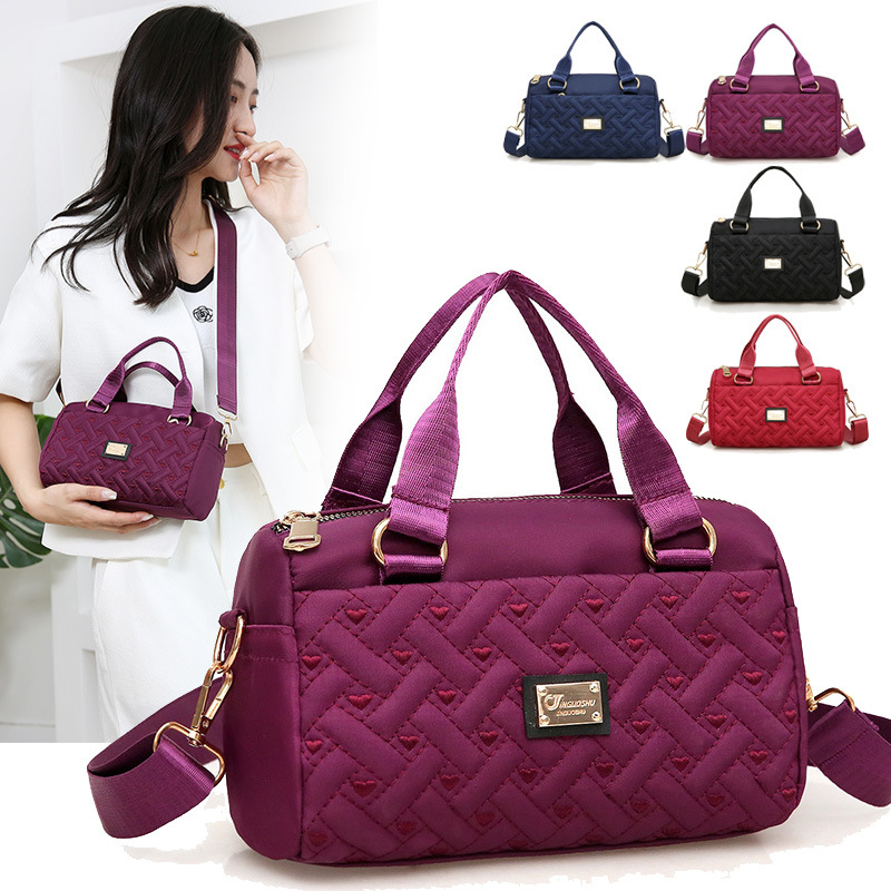Ženska crossbody torba, srednje veličine, tkanina, uspravni kvadratni oblik, zatvaranje na zip, unutarnje pretince: zip pretinac, pretinac za telefon, pretinac za dokumente, jedna naramenica, podstava poliester