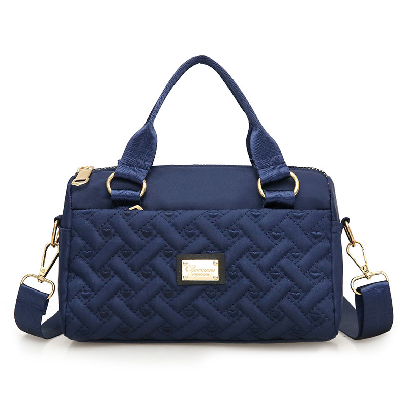 Ženska crossbody torba, srednje veličine, tkanina, uspravni kvadratni oblik, zatvaranje na zip, unutarnje pretince: zip pretinac, pretinac za telefon, pretinac za dokumente, jedna naramenica, podstava poliester