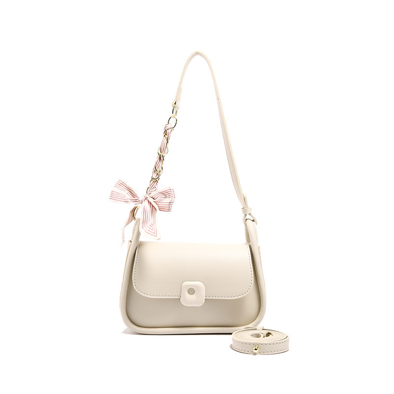 Ženska crossbody torbica u gradskom minimalističkom stilu, PU materijal, horizontalno kvadratičnog oblika, magnetsko zatvaranje, jednostruka naramenica, unutarnja organizacija: džep sa zipom i džep za telefon