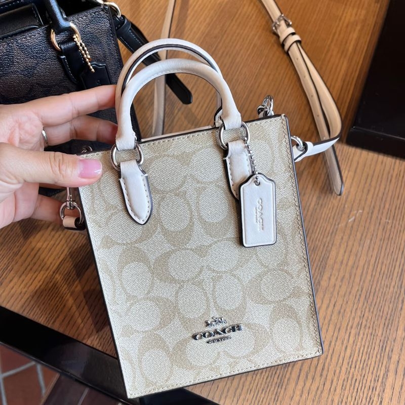 Ulična stil mini tote torba, split koža, uspravni kvadratni oblik, zatvarač, unutarnji džepovi za telefon i dokumente, dvostruke naramenice, proljeće 2025 izdanje