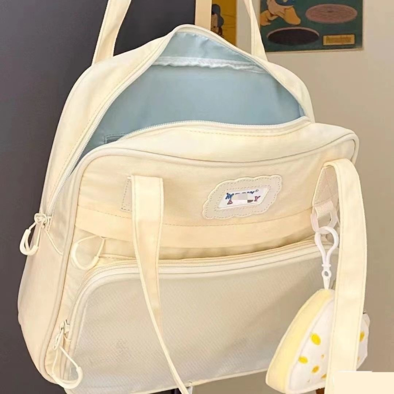 Auduma crossbody skolas soma, ietilpība 36-55 L, der 9 collu klēpjdatoram, izliektā pleca siksna, ielas stils