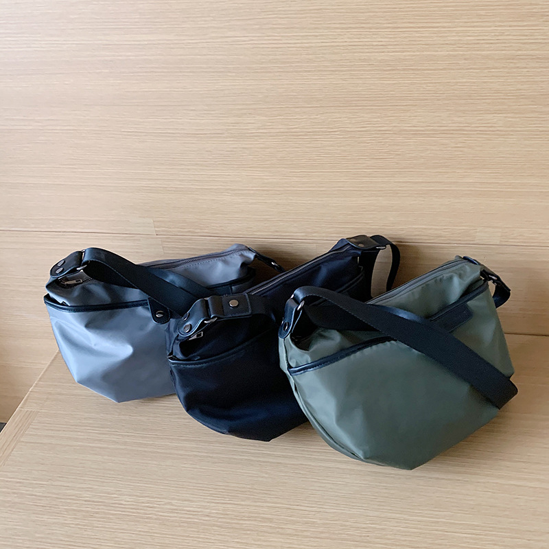 Ženska bucket torba preko ramena, najlon, zatvarač, ovalni oblik, poliester unutarnja podstava