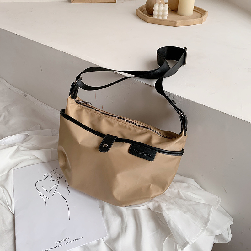Ženska bucket torba preko ramena, najlon, zatvarač, ovalni oblik, poliester unutarnja podstava