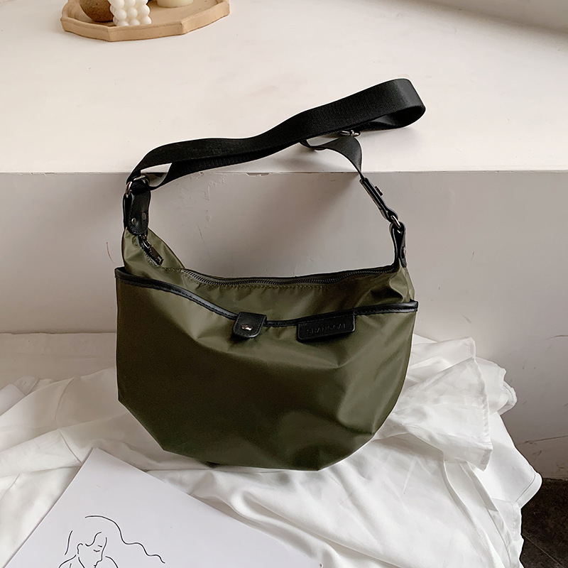 Ženska bucket torba preko ramena, najlon, zatvarač, ovalni oblik, poliester unutarnja podstava