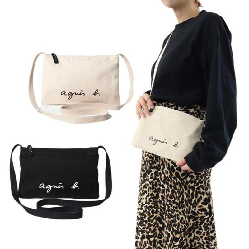 Platnena crossbody torba s zatvaračem, bez podstave, vodoravni kvadratni oblik, gradski minimalistički stil