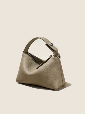 Első réteg marhabőrből készült tote táska, városi minimalistikus stílus, párnás alak, cipzáros zárás, belső zsebek telefon és ID számára