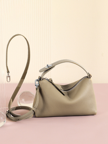 Első réteg marhabőrből készült tote táska, városi minimalistikus stílus, párnás alak, cipzáros zárás, belső zsebek telefon és ID számára