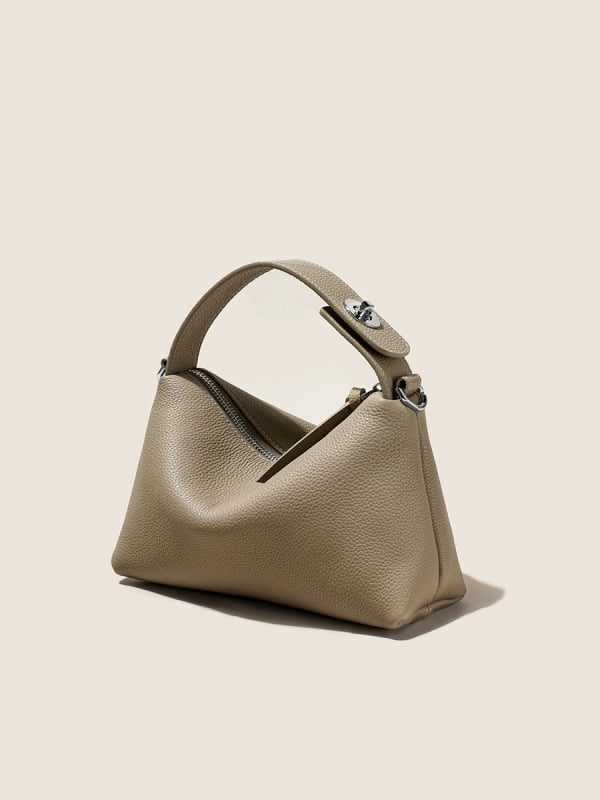 Első réteg marhabőrből készült tote táska, városi minimalistikus stílus, párnás alak, cipzáros zárás, belső zsebek telefon és ID számára