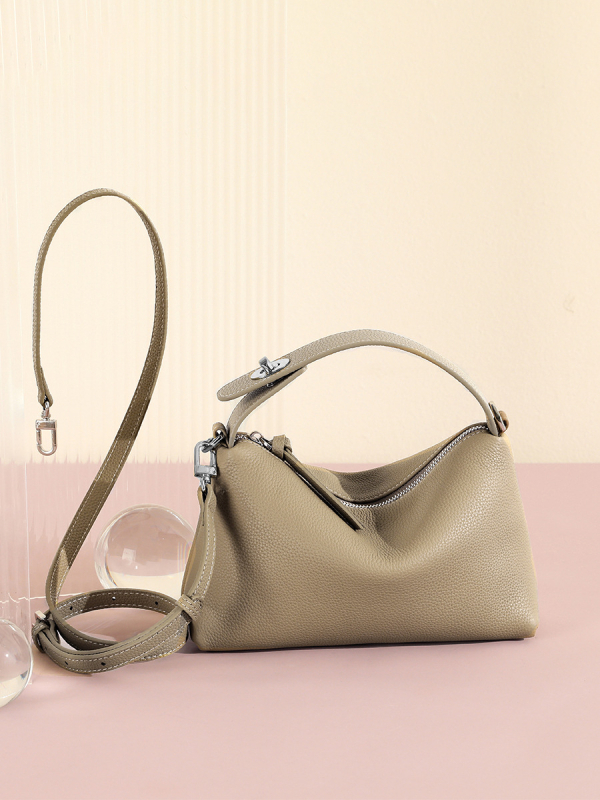 Első réteg marhabőrből készült tote táska, városi minimalistikus stílus, párnás alak, cipzáros zárás, belső zsebek telefon és ID számára